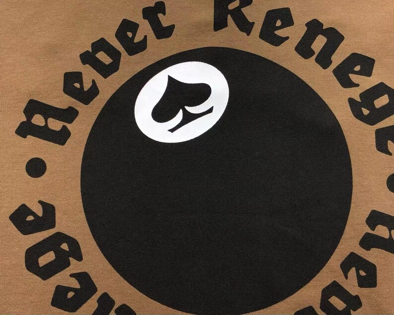 Detailed close-up of circular back embroidery text and logo