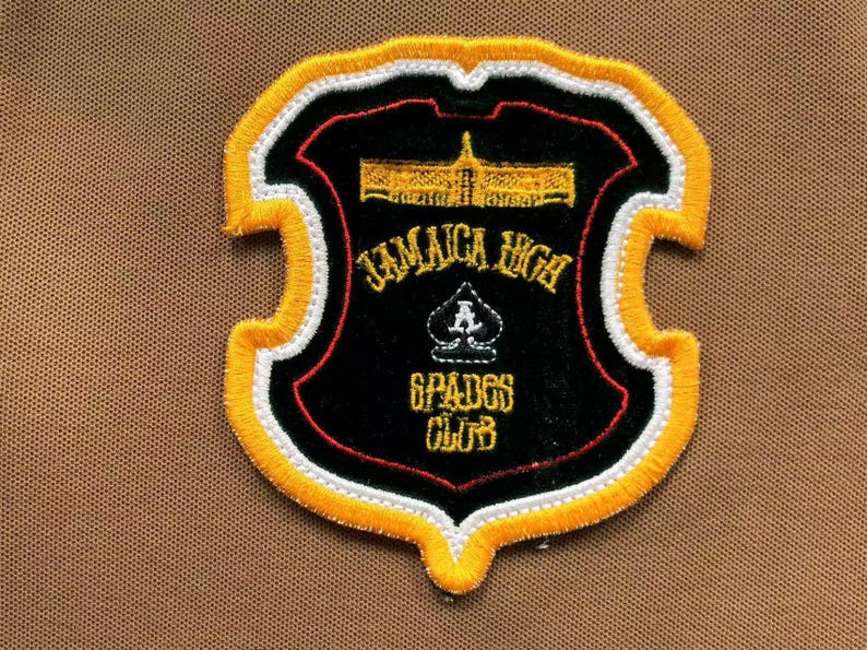 Close-up of embroidered crest patch on chest