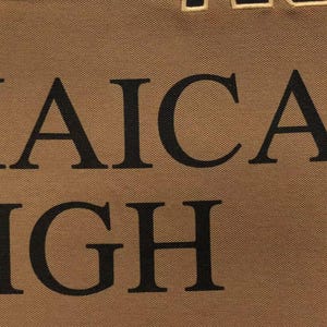 Detailed close-up of embroidered “Jamaica High” lettering