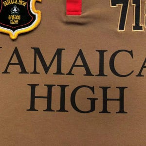 Close-up of “Jamaica High” text embroidery