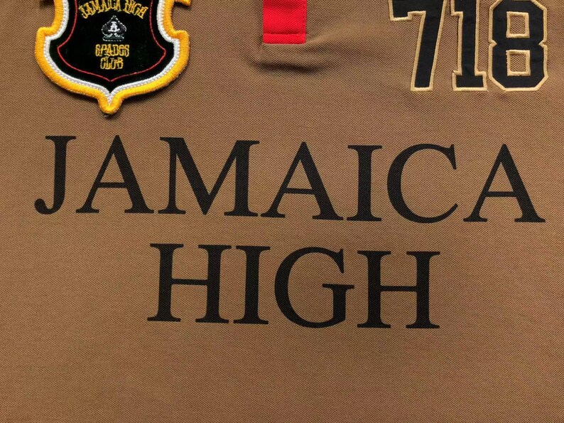 Close-up of “Jamaica High” text embroidery