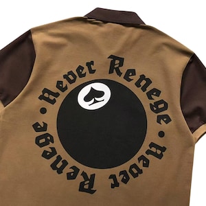 Close-up of circular “Respect Renegades” embroidered back design