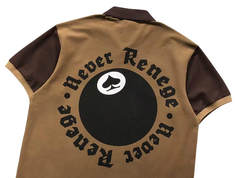 Close-up of circular “Respect Renegades” embroidered back design