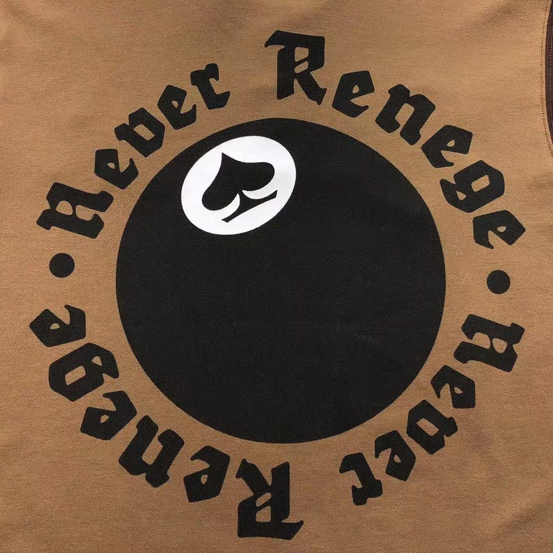 Close-up of circular “Respect Renegades” embroidered back design