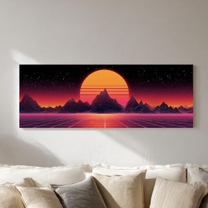 May include: A rectangular canvas print depicting a retro sunset scene. The artwork features a large orange sun, purple mountains, and a grid-like foreground. The print is mounted above a white sofa with beige pillows.
