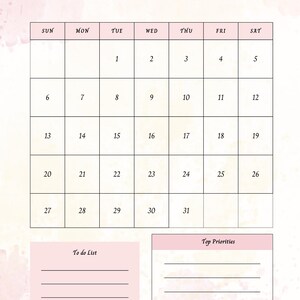 Op de afbeelding: Een december 2026 kalender met een zachte roze en witte aquarel achtergrond. Het kalenderraster is in een rasterformaat met de dagen van de week bovenaan. Er zijn ook secties "To do List" en "Top Priorities".