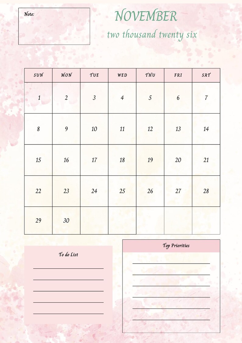 Op de afbeelding: Een roze en witte november 2026 kalender met een aquarelontwerp. De kalender bevat een takenlijst en een sectie voor topprioriteiten. Het woord "November" is in groene letters geschreven.