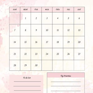 Op de afbeelding: Een juni 2026 kalender met een aquarel achtergrond in roze en cr&egrave;me tinten. De kalenderraster is in een klassiek formaat met de dagen van de week bovenaan. Bevat een "To do List" en "Top Priorities" sectie. Het woord "Juni" staat bovenaan.