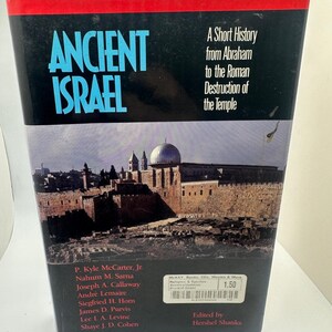 May include: A hardcover book titled "ANCIENT ISRAEL" with a black cover and a red top edge. The book features a photograph of a city with a domed building. The text on the cover reads "A Short History from Abraham to the Roman Destruction of the Temple."