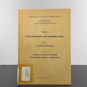 May include: A tan softcover book titled Freiburger Waldschutz-Abhandlungen, VW-Symposion Feuerökologie, featuring black text on the cover and a white library classification label in the bottom left corner with the text QH 545 .F5 D431 1978.