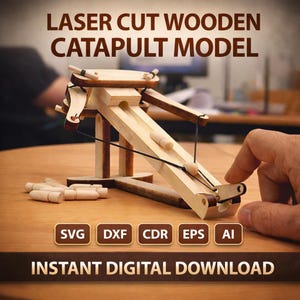 May include: A laser-cut wooden catapult model made of light-colored wood. The model includes a launching arm, a base, and several small wooden projectiles. The text "LASER CUT WOODEN CATAPULT MODEL" is at the top. The text "INSTANT DIGITAL DOWNLOAD" is at the bottom.