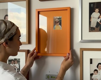 Cornice monocromatica (9"x13"): scegli l'angolo della foto, il colore della cornice, la dimensione dell'apertura del passepartout e la posizione