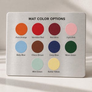 May include: A rectangular metal plate displays "MAT COLOR OPTIONS" with ten circular color swatches. Colors include Pure Orange, Vermilion Red, Red Wine, Light Pink, Baby Blue, Choco Brown, Deep Blue, Moss Green, Mint Green, and Butter Yellow.