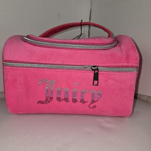 Straight-on shot of the pink velvet makeup organizer with rhinestone lettering.