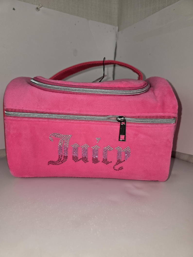 Straight-on shot of the pink velvet makeup organizer with rhinestone lettering.
