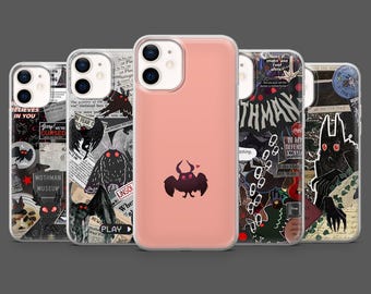 May include: A collection of phone cases with various designs. One case is light pink with a black cartoon moth. Other cases feature collages with the words "Mothman Museum", "Believes in You", and "Unsolved".