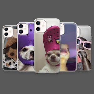 May include: A collection of five phone cases featuring humorous images of animals. The cases showcase a dog wearing sunglasses, a dog in a purple Croc, a dog in a pink Croc, a duck, and a sloth wearing sunglasses. The cases are clear with the images visible.