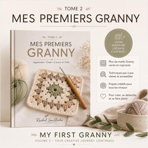 Op de afbeelding: Een hardcover boek getiteld Mes Premiers Granny Tome 2, met een gehaakt granny square en een haaknaald met houten handvat op de kaft. Het boek bevat teksten over haaktechnieken, gevarieerde patronen en creatieve projecten voor elk niveau.