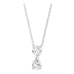 May include: A silver-toned necklace featuring a delicate chain and a pendant composed of two clear, faceted stones. The upper stone is round, while the lower stone is pear-shaped, both secured in a polished metal setting that catches the light.