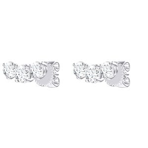 May include: A pair of silver-toned stud earrings, each featuring three round, clear, faceted stones arranged in a curved, horizontal row. The stones are held in place by metal prongs, and the earrings include a secure post-back closure mechanism.