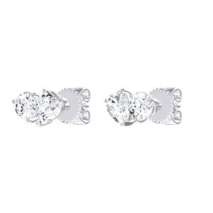 May include: A pair of silver-toned stud earrings, each featuring two clear, faceted stones. One stone is round and the other is pear-shaped, both set in a metallic frame with a secure post backing. The design is symmetrical and reflective.