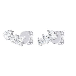 May include: A pair of silver-toned stud earrings, each featuring three clear, pear-shaped stones arranged in a graduated, curved line. The earrings include a secure post backing with a circular, textured edge, showcasing a polished metallic finish.
