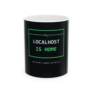 May include: A black ceramic mug with a white interior featuring a green-outlined terminal window graphic. The text reads LOCALHOST IS HOME in white and green, with the additional text 127.0.0.1 sweet 127.0.0.1 printed in white below.