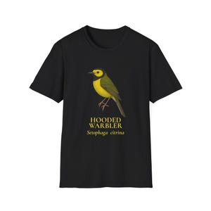 May include: Black t-shirt featuring a detailed illustration of a Hooded Warbler bird with yellow and green plumage. The text "HOODED WARBLER Setophaga citrina" is printed below the bird image.