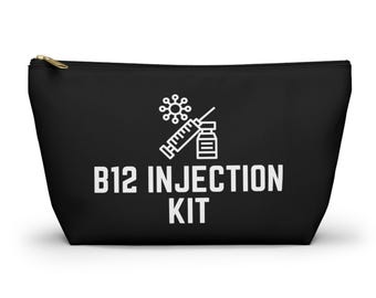 May include: Black zippered pouch with a white graphic of a syringe, vial, and a stylized virus. The text "B12 INJECTION KIT" is printed in white below the graphic. The pouch has a gold-colored zipper.