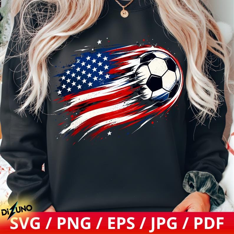 May include: A black long-sleeve sweatshirt featuring a graphic print of a football trailing a stylised American flag design with red, white, and blue brushstroke effects and small white stars on the front centre of the garment.