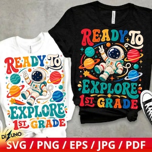 May include: A white t-shirt and a black t-shirt, each featuring a colorful graphic of an astronaut floating in space surrounded by planets and stars. The text reads READY TO EXPLORE 1ST GRADE in a retro, wavy font style with vibrant colors.