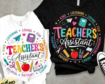 May include: Two t-shirts, one white and one black, with a colorful graphic design. The design features the words "Teacher's Assistant" surrounded by words like "Kind," "Loving," and "Caring," along with school-related icons.