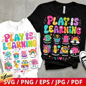 May include: A white t-shirt and a black t-shirt, each featuring the colorful text "PLAY IS LEARNING" and various cartoon illustrations including a globe, a pencil, a school bus, a rainbow, and a brain, with labels for each educational concept.