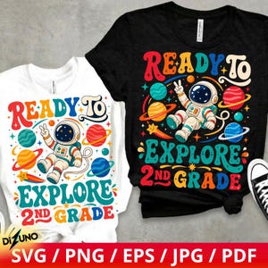 May include: A white t-shirt and a black t-shirt, each featuring a colourful graphic of an astronaut floating in space surrounded by planets and stars. The text reads READY TO EXPLORE 2ND GRADE in a bold, retro-style font with vibrant multi-coloured letters.