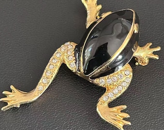 Broche de rana vintage en tono dorado, esmalte negro, pedrería, alfiler anfibio