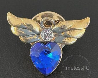 Vintage sieraden Avon juli geboortesteenspeld blauw robijnrood hart goudkleurige engelenvleugels broche