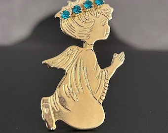 Broche vintage de ángel rezando en tono dorado con corona de diamantes de imitación azules.