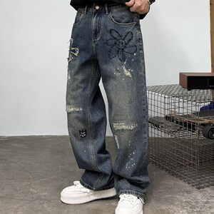 Patchwork Denim Jeans | Ripped Distressed Straight Design | Daily Wear | Y2K Streetwear Style

Patchwork denim jeans with ripped distressed details and straight leg fit, styled for streetwear outfits, casual looks, and everyday fashion.