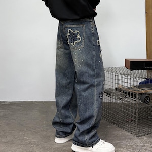 Patchwork Denim Jeans | Ripped Distressed Straight Design | Daily Wear | Y2K Streetwear Style

Patchwork denim jeans with ripped distressed details and straight leg fit, styled for streetwear outfits, casual looks, and everyday fashion.