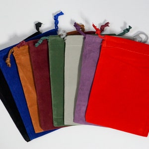 May include: Assortment of ten velvet drawstring bags in various colors, including black, blue, brown, burgundy, green, gray, purple, and red.