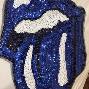 May include: A set of three ceramic mugs with a speckled, matte finish. The mugs are in shades of cream, light gray, and dark gray. Each mug has a simple, minimalist design, perfect for coffee or tea.