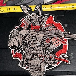 May include: A set of three ceramic mugs with a speckled, matte finish. The mugs are in shades of cream, light gray, and dark gray. Each mug has a simple, minimalist design, perfect for coffee or tea.