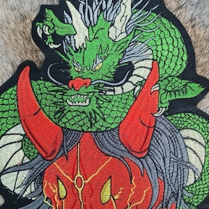 May include: A set of three ceramic mugs with a speckled, matte finish. The mugs are in cream, light grey, and dark grey. Each mug has a simple, minimalist design, ideal for coffee or tea.