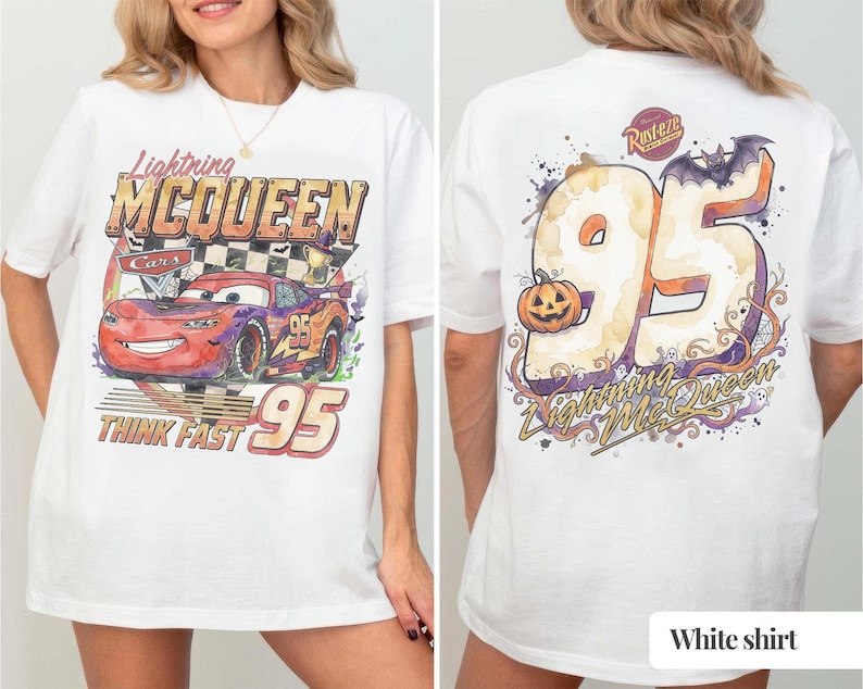 May include: A white t-shirt featuring a graphic of Lightning McQueen from the movie Cars on the front with the text Lightning McQueen and Think Fast 95. The back displays a large number 95 with a pumpkin, a bat, and the text Lightning McQueen.