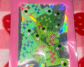 Pacote de miniaturas de dinossauros em Perler