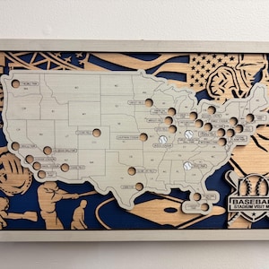 May include: Wooden baseball stadium visit map with a silver frame. The map features the United States with baseball stadium locations marked. The design includes baseball-themed cutouts and the text "BASEBALL STADIUM VISIT MAP".