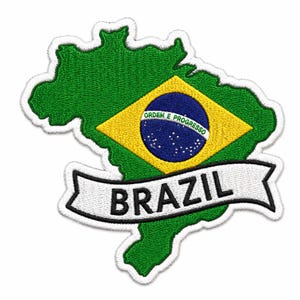 May include: An embroidered patch shaped like the map of Brazil, featuring a green background with a central yellow diamond and a blue globe containing the text ORDEM E PROGRESSO. A white banner across the bottom displays the word BRAZIL in black.