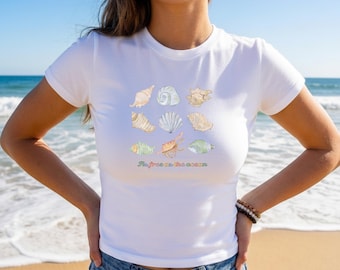 As Free As The Ocean Graphic Baby Tee, Women’s Coastal Quote Top, Seashell Lover Cropped Shirt
