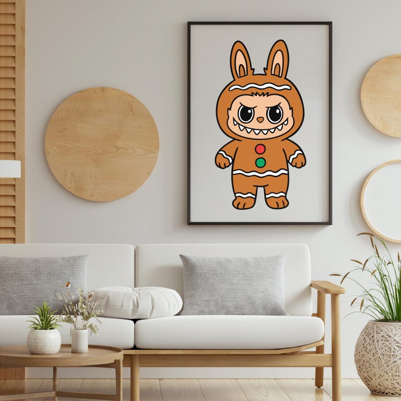 May include: A framed art print featuring a cartoon character in a gingerbread bunny costume. The character has a stern expression, with a brown and white color scheme. The artwork is displayed on a light gray wall above a white sofa.