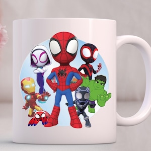 May include: A set of three ceramic mugs with a speckled, matte finish. The mugs are in cream, light grey, and dark grey. Each mug has a simple, minimalist design, ideal for coffee or tea.